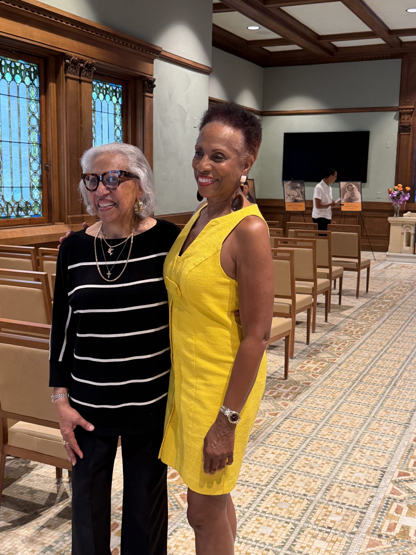 Family members honoring Jewelia Galloway Higgins at Woodland Cemetery